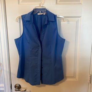 Sleeveless button up with ruffle detail .